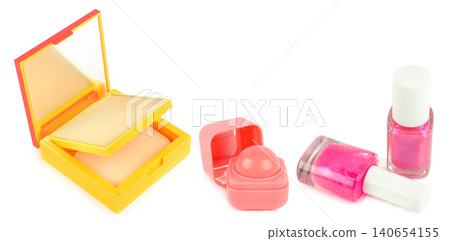 High angle studio shot of decorative cosmetics set including face powder compact, round pink lip balm, and two shiny bottles of pink nail polish isolated on white background, horizontal banner. High angle studio shot of decorative cosmetics set including face powder compact, round pink lip balm, and two shiny bottles of pink nail polish isolated on white background, horizontal banner. 140654155