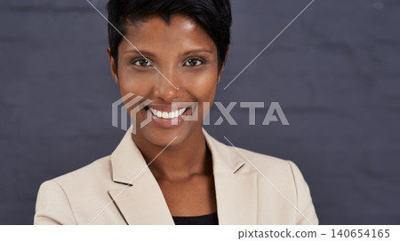 Indian woman, portrait and corporate professional with smile, pride and ambition with confidence on wall background. Happy in career, job satisfaction in business and real estate agent in Mumbai Indian woman, portrait and corporate professional with smile, pride and ambition with confidence on wall background. Happy in career, job satisfaction in business and real estate agent in Mumbai 140654165
