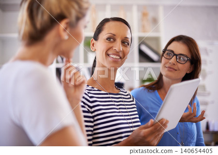 Discussion, tablet and business women in creative agency for website, online project and planning. Collaboration, startup company and workers on digital tech for research, feedback and teamwork 140654405