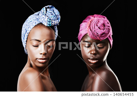 Black women, head wrap and relax portrait with beauty, skincare and natural cosmetics in studio. Traditional, turban and African fashion with wellness and skin glow with makeup and dark background Black women, head wrap and relax portrait with beauty, skincare and natural cosmetics in studio. Traditional, turban and African fashion with wellness and skin glow with makeup and dark background 140654455