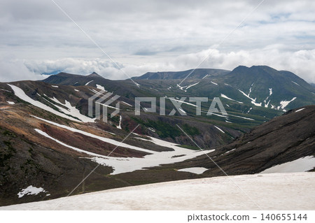 Scenes from a climb of Mt. Asahidake in early summer, with lingering snow. Scenes from a climb of Mt. Asahidake in early summer, with lingering snow. 140655144