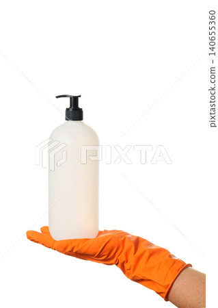 white dispenser bottle for liquid soap or antiseptic in a hand in an orange glove on a white background white dispenser bottle for liquid soap or antiseptic in a hand in an orange glove on a white background 140655360