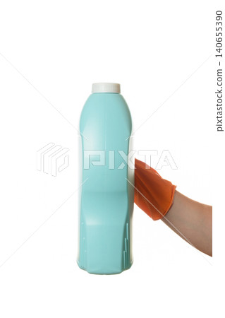 hand in a rubber glove holding a large blue bottle of product hand in a rubber glove holding a large blue bottle of product 140655390