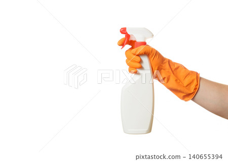 hand in a rubber glove holding a white spray with a red trigger hand in a rubber glove holding a white spray with a red trigger 140655394