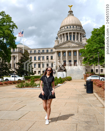 Woman Strolling on Stone Plaza at Mississippi State Capitol Grounds Jackson Woman Strolling on Stone Plaza at Mississippi State Capitol Grounds Jackson 140655550
