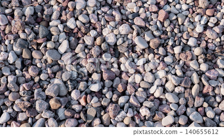 Colorful Rounded Pebbles For Landscaping, Smooth River Stones In Closeup With Varied Hues And Polished Surface, Decorative Hardscape Application For Garden Path And Patio, Natural Tones Colorful Rounded Pebbles For Landscaping, Smooth River Stones In Closeup With Varied Hues And Polished Surface, Decorative Hardscape Application For Garden Path And Patio, Natural Tones 140655612