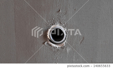 Round Conduit Hole In Wall, Inspector Documenting Penetration During House Construction Closeup Of Circular Opening With Mortar Edges And Raw Plaster Texture, Practical View For Site Round Conduit Hole In Wall, Inspector Documenting Penetration During House Construction Closeup Of Circular Opening With Mortar Edges And Raw Plaster Texture, Practical View For Site 140655633