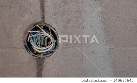 Exposed Electrical Junction In Ceiling During House Construction, Electrician Prepping Wires For Outlet Installation, Plaster And Concrete Textures, Closeup Detail For Inspection And Smart Exposed Electrical Junction In Ceiling During House Construction, Electrician Prepping Wires For Outlet Installation, Plaster And Concrete Textures, Closeup Detail For Inspection And Smart 140655643