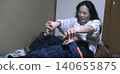 A tall woman who performs hypnosis 140655875
