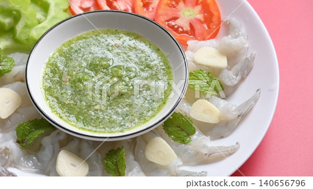 shrimp in fish sauce with Thai spicy seafood dipping sauce on white plate shrimp in fish sauce with Thai spicy seafood dipping sauce on white plate 140656796