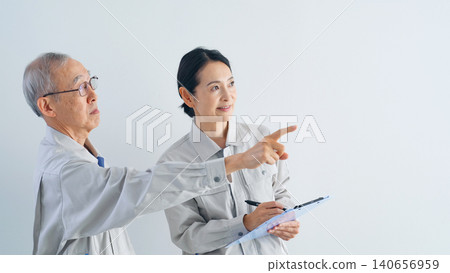 Senior men and middle-aged women in work clothes Senior men and middle-aged women in work clothes 140656959