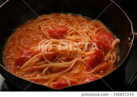 Tomato sauce pasta being cooked Tomato sauce pasta being cooked 140657245