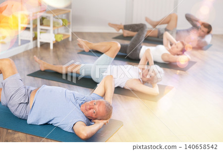 Elderly man doing pilates in group 140658542