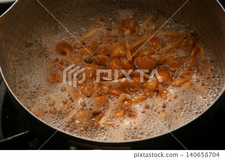Making miso soup with nameko mushrooms. Making miso soup with nameko mushrooms. 140658704