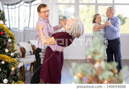 Adult man and elderly woman dance waltz 140659086