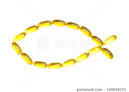 Yellow capsules arranged in a fish shape highlight nutrition concept, PNG 140659255