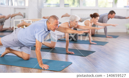 Senior male participant working out practice Balancing table, Dandayama Bharmansana Senior male participant working out practice Balancing table, Dandayama Bharmansana 140659527