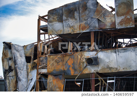 Exterior view of a severely damaged building after a devastating fire incident Exterior view of a severely damaged building after a devastating fire incident 140659597