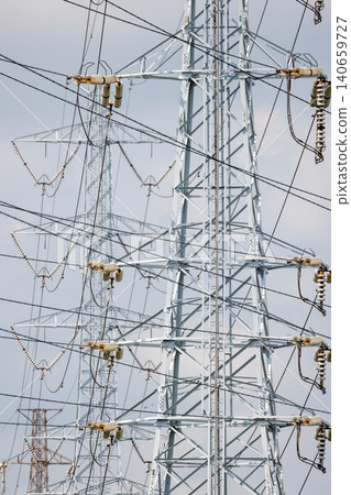 High-voltage power transmission towers and power lines 140659727