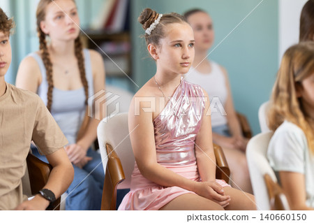 During lecture meeting at class, teens and preteens pupil listen to female teacher During lecture meeting at class, teens and preteens pupil listen to female teacher 140660150