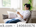 A man reading a book 140660876