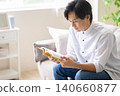 A man reading a book 140660877