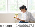 A man reading a book 140660878
