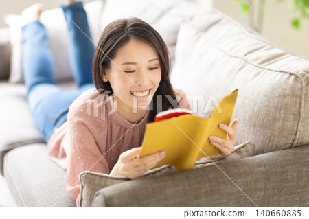 A woman reading a book 140660885