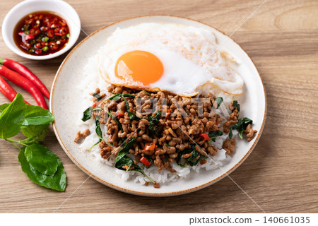 Thai food, Stir-fried holy basil with minced pork with cooked rice and fried egg  140661035