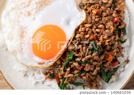Thai food, Stir-fried holy basil with minced pork with cooked rice and fried egg on top, Top view 140661036
