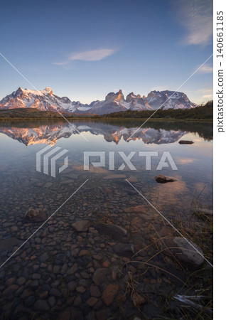 Patagonia mountain lake reflection at dawn with clear sky and snow peak Patagonia mountain lake reflection at dawn with clear sky and snow peak 140661185