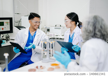 Team of Diverse Asian Scientists Conducting Research in Modern Laboratory Team of Diverse Asian Scientists Conducting Research in Modern Laboratory 140661341