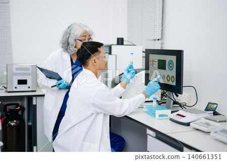 Food science as lab scientists test and analyze vegetables for safety and quality using advanced technology and precise equipment. Food science as lab scientists test and analyze vegetables for safety and quality using advanced technology and precise equipment. 140661351
