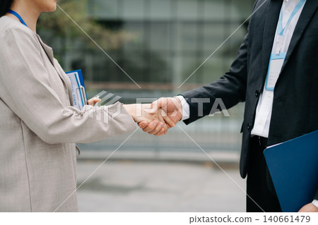 Two confident business man shaking hands during a meeting in the office, success, dealing, greeting and partner 140661479