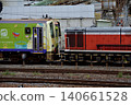 A KiHa 120 series diesel railcar being moved to a new location. 140661528