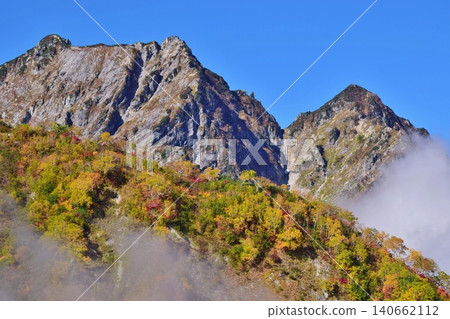 The peaks of Hakuba are at the height of their autumn foliage. The peaks of Hakuba are at the height of their autumn foliage. 140662112