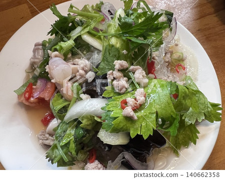 Yum Woon Sen: Thai-style spicy salad with glass noodles and seafood. Yum Woon Sen: Thai-style spicy salad with glass noodles and seafood. 140662358