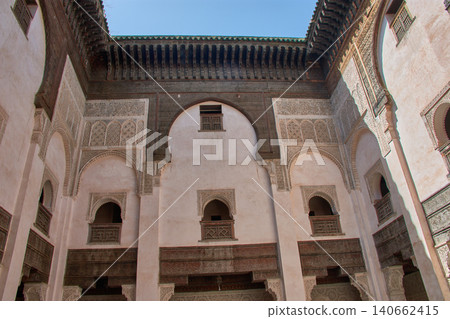 Architectural view of the historic courtyard at the Al-Attarine Madrasa with Moorish arches in Fez, Morocco 140662415