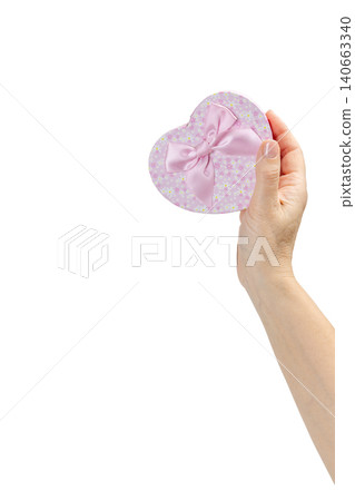 Woman's hand holding a gift box on the white background. 140663340