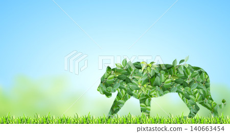 Tiger silhouette made of green leaves on sunny background. Ecology, global ecological resource, go green concept. Environmental conservation, wildlife protection, Eco-friendly, Green Energy Tiger silhouette made of green leaves on sunny background. Ecology, global ecological resource, go green concept. Environmental conservation, wildlife protection, Eco-friendly, Green Energy 140663454