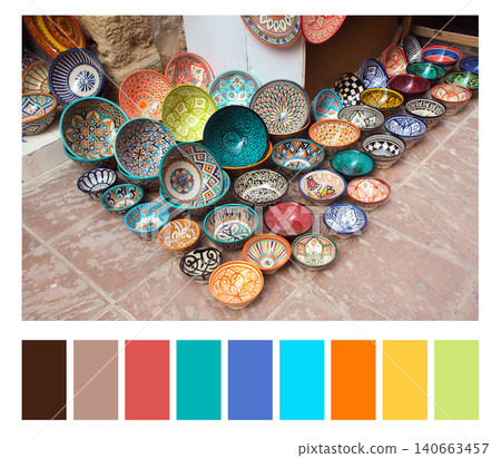 Color matching palette with complementary colour swatches. Color matching palette: traditional moroccan souvenirs - plates and pots made of clay, street souk in Essaouira, Morocco, North Africa Color matching palette with complementary colour swatches. Color matching palette: traditional moroccan souvenirs - plates and pots made of clay, street souk in Essaouira, Morocco, North Africa 140663457