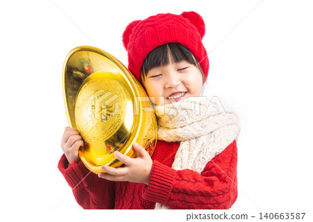 Happy Asian girl holding a large gold ingot (Yuanbao) wishing for wealth and prosperity in Chinese New Year.The Chinese characters above: "Attract Wealth and Treasure" Happy Asian girl holding a large gold ingot (Yuanbao) wishing for wealth and prosperity in Chinese New Year.The Chinese characters above: "Attract Wealth and Treasure" 140663587
