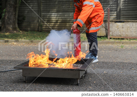 fire prevention. corporate safety - exercise during a firefighting course fire prevention. corporate safety - exercise during a firefighting course 140663814