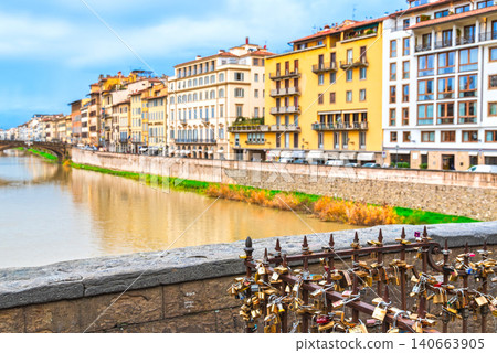 Florence in winter: A view of the town along the Arno River from the Ponte Vecchio. Florence in winter: A view of the town along the Arno River from the Ponte Vecchio. 140663905