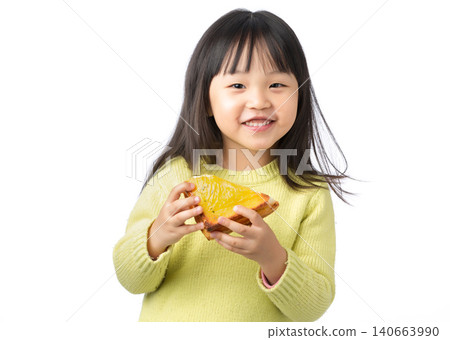 Asian Little Girl Eating Sandwich as Healthy Meal 140663990