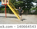 A tall woman relaxing in the park 140664543