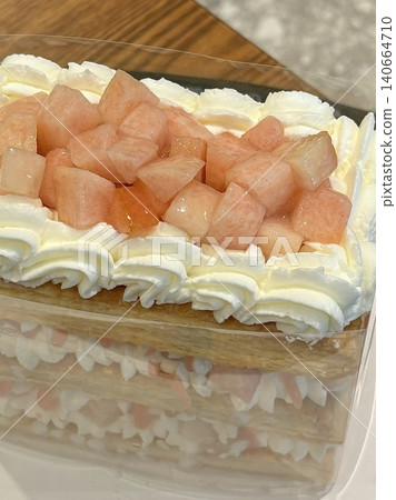 A delectable slice of cake with rich layers of cream and frosting, topped with fresh fruit or sprinkles. Perfect for dessert photography, showcasing indulgence and sweetness in food-related projects. A delectable slice of cake with rich layers of cream and frosting, topped with fresh fruit or sprinkles. Perfect for dessert photography, showcasing indulgence and sweetness in food-related projects. 140664710