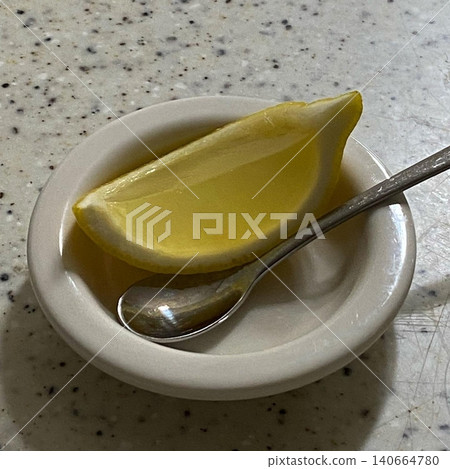 Bright and refreshing lemon slice with vibrant yellow color and juicy citrus texture. Perfect for adding a zesty lift to drinks, desserts, or fresh culinary creations. Bright and refreshing lemon slice with vibrant yellow color and juicy citrus texture. Perfect for adding a zesty lift to drinks, desserts, or fresh culinary creations. 140664780