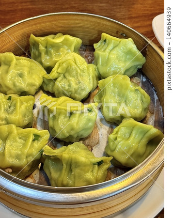 Korean dumplings filled with a mix of savory ingredients like ground meat, tofu, and vegetables. Mandu can be steamed, boiled, or pan-fried, making it a versatile and delicious snack or meal. Korean dumplings filled with a mix of savory ingredients like ground meat, tofu, and vegetables. Mandu can be steamed, boiled, or pan-fried, making it a versatile and delicious snack or meal. 140664939