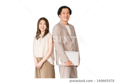 A male and female businessman standing with a laptop computer. A male and female businessman standing with a laptop computer. 140665078